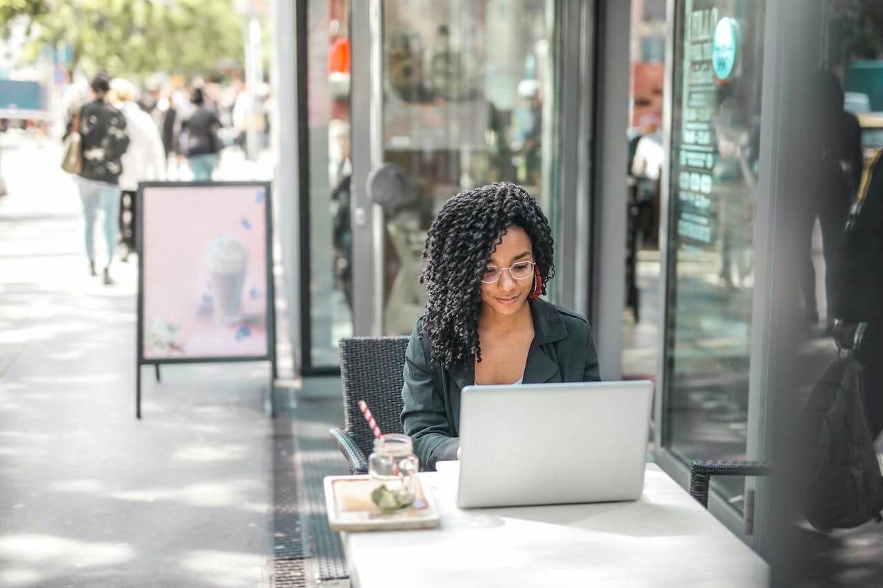 A girl sitting in a coffee shop in front of the laptop.jpg