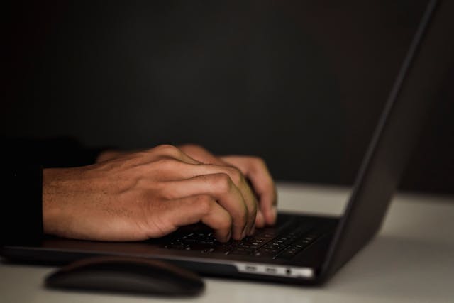 A man typing on computer - Koofr blog encryption