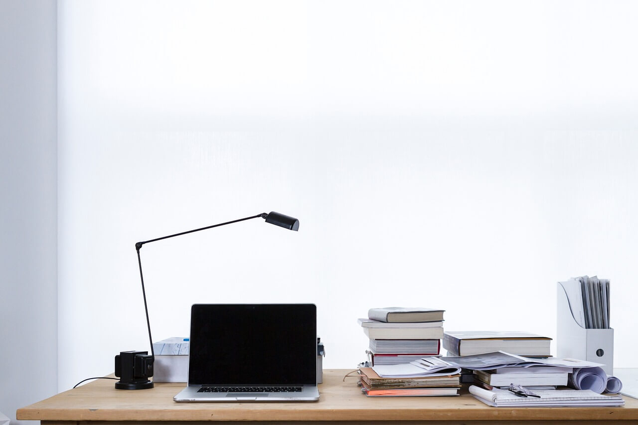 Laptop, lamp and books on the table.jpg