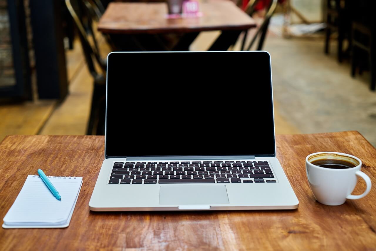 Laptop, notebook and coffee - Koofr blog